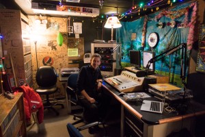 Jeffrey Donenfeld at the controlboard of 104.5 Ice Radio, McMurdo Station, Antarctica