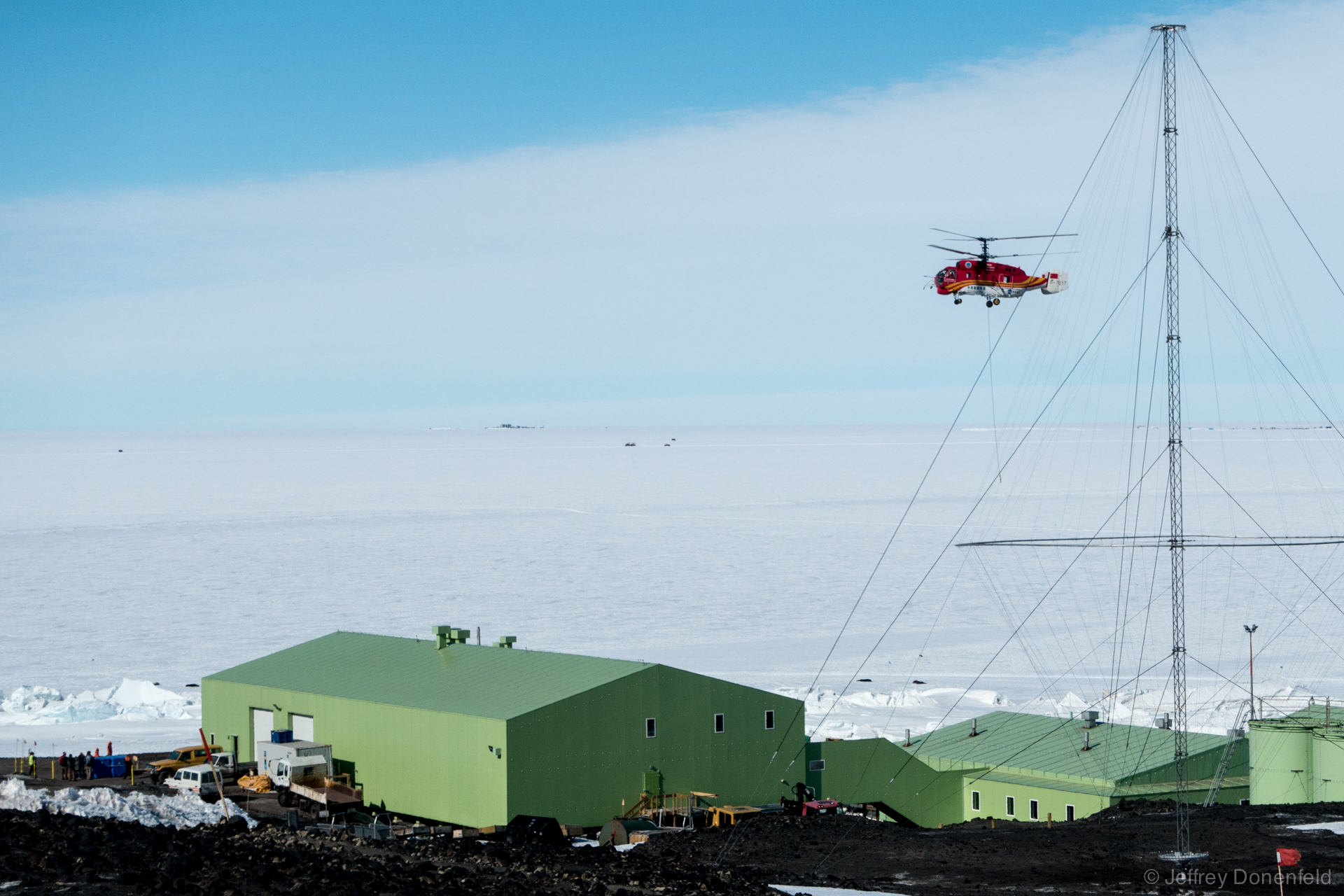 A Chinese-Operated Kamov KA-32 Helicopter hovers over New Zealand's Scott Base.