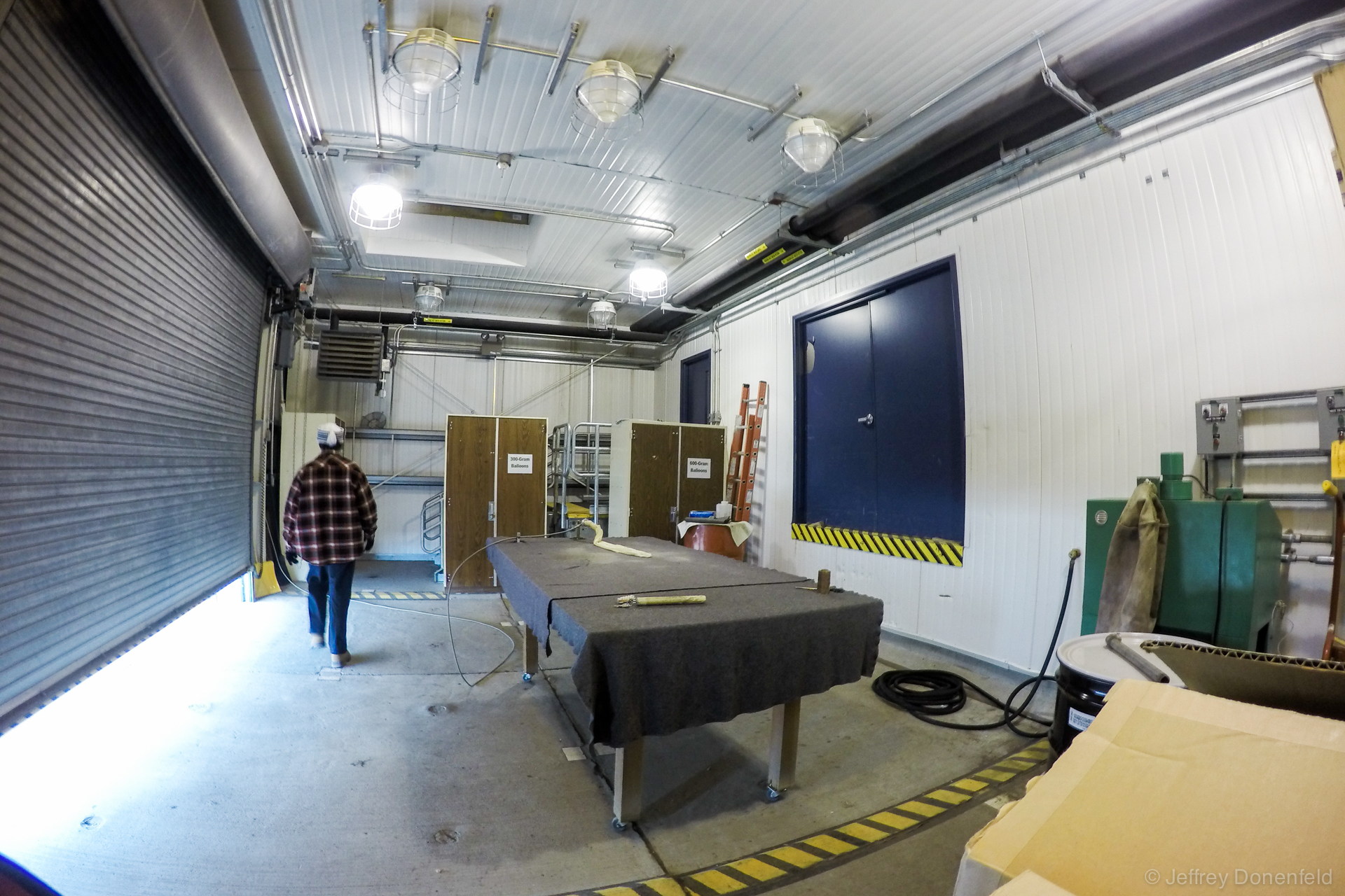 Inside the McMurdo Baloon Inflation Facility, a large, padded table accomodates the filling balloon, as well as weights to check the lifting power.