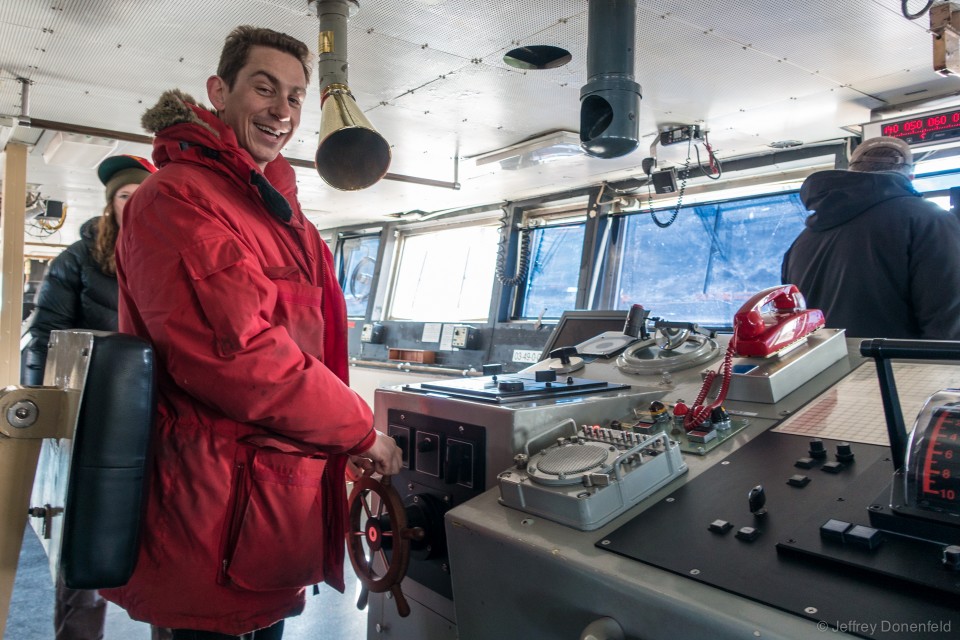 Me at the helm. Since all steering is electronically controlled, and can be done from various points on the ship, the main helm is strangely small! I swear, the size of the helm is not proportional to the might of the ship.