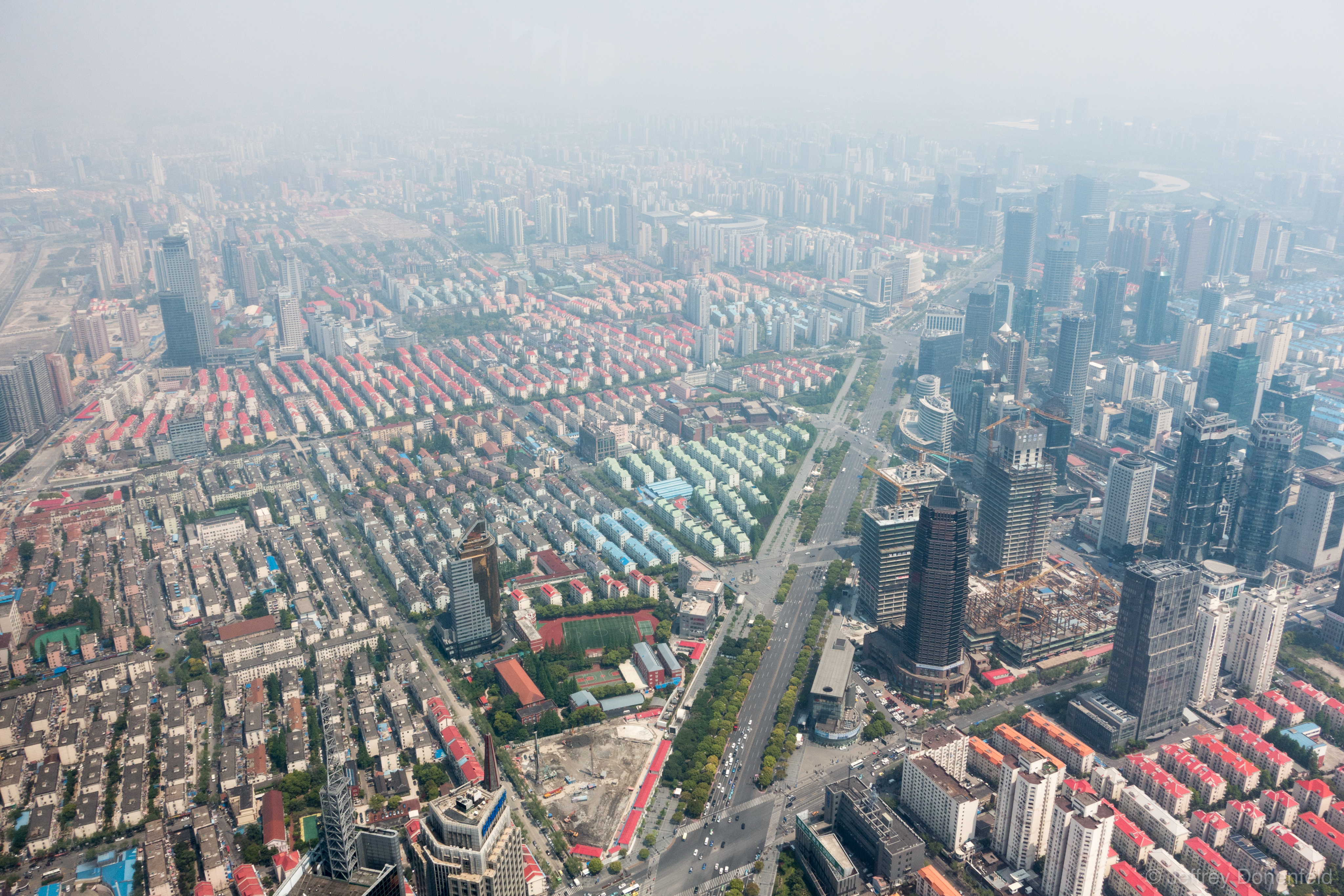 Rampant building in Shanghai seen from the worlds highest observation deck - 474 meters in the Shanghai World Financial Center.