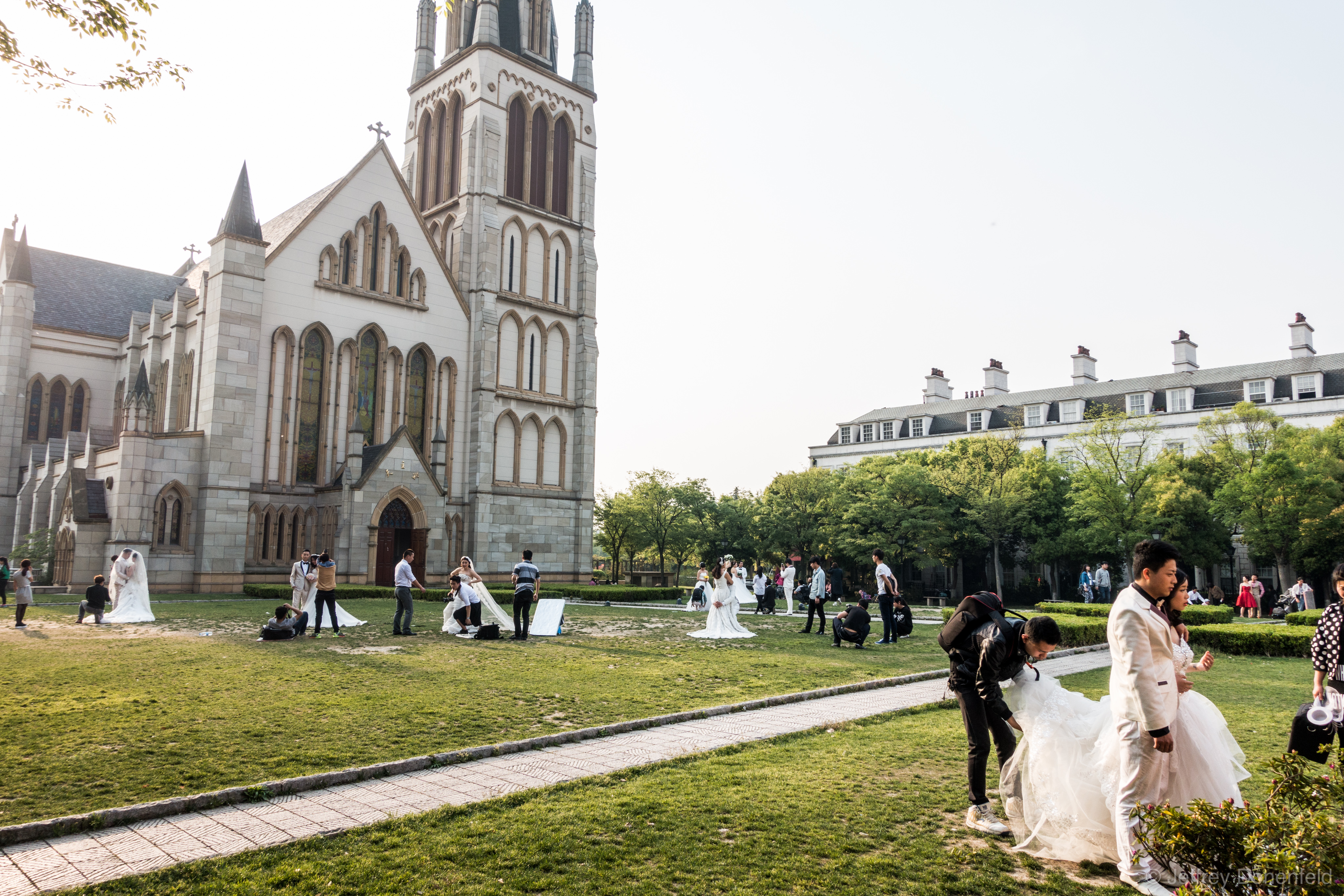 Couples taking wedding engagement photos are everywhere in Thames Town, a Chinese copy of a traditional British town.  How many couples can you count?